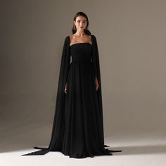 Make a lasting impression with our luxurious chiffon A-line dress. Its unique cape sleeves add elegance and sophistication to any occasion. In black, command attention and embrace yourself with this must-have dress. Cape Sleeves Gown, Black Gowns, Cape Sleeve Dress, Embrace Yourself, Formal Fashion, Eid Dresses, Cape Sleeves, Dress Xl, Black Gown