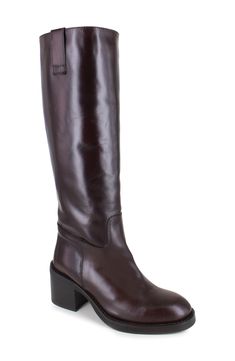 A block heel adds just the right amount of lift to this suave and streamlined knee-high boot. 2" heel 19" shaft; 12" calf circumference Leather upper, lining and sole Made in Italy Classic Knee-high Heeled Boots With Leather Lining, Classic Wide Calf Knee-high Boots With Block Heel, Classic Knee-high Boots With Wide Calf And Block Heel, Classic Knee-high Boots With Block Heel For Business, Classic Wide Calf Platform Boots For Workwear, Classic Knee-high Platform Boots For Business, Business Knee-high Boots With Leather Lining, Fall Leather Boots, Brown Leather Knee High Boots