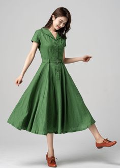 This vintage-inspired short-sleeved shirt dress is the perfect addition to any retro lover's wardrobe! Featuring a classic collared neckline, front button closure, and a flattering A-line silhouette, this dress is both timeless and trendy. The lovely shade of green is sure to turn heads and the lightweight fabric makes it perfect for warmer weather. DETAILS *  100% linen *  Two side pockets *  Front Button up closure *  Belted dress *  Short sleeve *  Notched collar *  Below knee Length *  Perfe Fit And Flare Dress Short, Green Linen Dress, Custom Dress, Wool Clothing, Vestidos Vintage, Dress Short Sleeve, Green Outfit, Green Midi Dress, Midi Shirt Dress