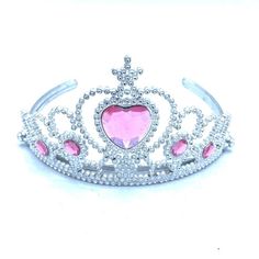 a tiara with pink stones and a heart on the front, set against a white background