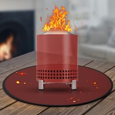 a red fire pit sitting on top of a wooden table