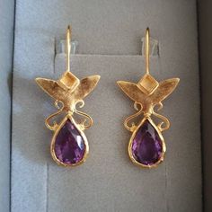 These Gold Amethyst earrings were designed in an antique inspired style, for a royal, romantic look. The Drop gold Amethyst earrings shine in a beautiful deep, see through purple color,  and are very elegant. Perfect teardrop earrings - a great gift for women and beautiful bridal earrings! Materials: The 14k gold earrings are available in 14k nickel free gold plating OR sterling silver.  The Gold Amethyst earrings are also available in 9k OR 14k Solid gold. The gold teardrop earrings were carefu Earrings Teardrop, Birthstone Earrings, Earrings Purple, Great Gifts For Women, Purple Earrings, Birthstone Earring, Earrings Drop, Amethyst Earrings, Pendant Design