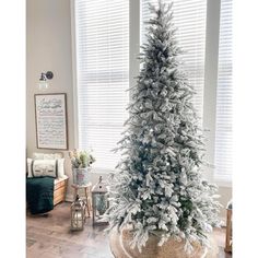 a white christmas tree in a living room