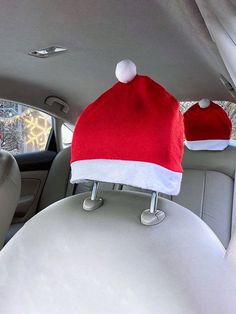 a santa hat sitting on the back seat of a car