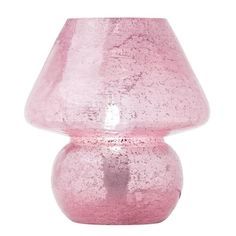 a pink vase sitting on top of a white table