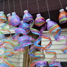 colorful streamers hanging from the side of a house