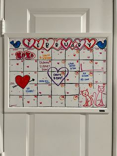 a white door with a calendar on it and hearts painted on the front doors side by side