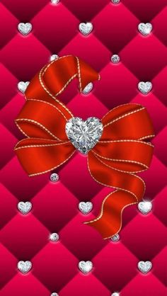 a red bow with hearts on it and diamonds in the backgroung background