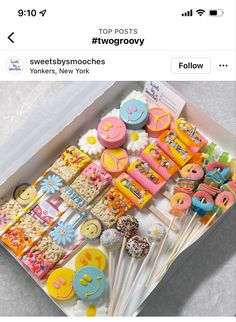 a box filled with lots of cake and marshmallows on top of a table