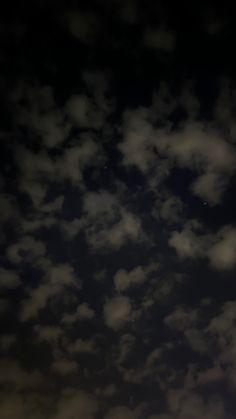 an airplane flying in the sky at night