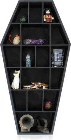 a black hexagonal shelf filled with lots of different items on top of it