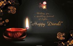 happy diwali greeting card with lit candle on dark background and floral border design