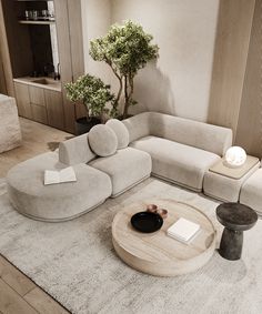 a living room filled with furniture and a tree in the corner on top of a rug