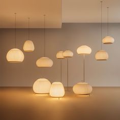 a group of lamps hanging from the ceiling