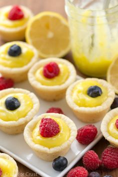 small desserts with raspberries and lemon on a plate