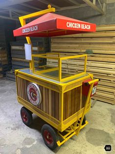 a yellow cart with a red umbrella on top