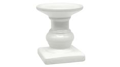 a white ceramic candle holder on a white background