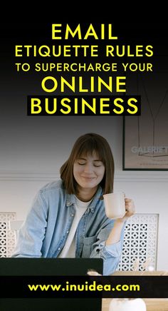 a woman sitting in front of a laptop computer holding a cup