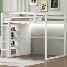 a white loft bed with built - in desk and bookcase underneath it, sitting on a hard wood floor