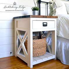 a white nightstand with a basket on top