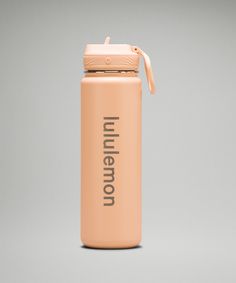 a pink water bottle with the word umberio on it and an orange strap