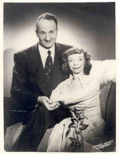 an old black and white photo of a man and woman