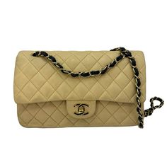 This Vintage Chanel Shoulder Bag Is A Must-Have For Any Fashion-Forward Woman. Crafted From High-Quality Leather, It Features A Timeless Beige And Black Design With Subtle Hardware Accents. The Small Size And Convenient Strap Make It Perfect For On-The-Go Occasions. The Interior Is Lined With Luxurious Lambskin In A Matching Beige Color, Providing A Soft And Elegant Touch. Whether You're Dressing Up Or Down, This Classic Chanel Bag Is Sure To Elevate Any Outfit. Good Vintage Condition. No Major Blemishes. Includes Box, Authenticity Card, Dust Bag. Classic Chanel Bag, Classic Chanel, Chanel Shoulder Bag, Beige And Black, Chanel Vintage, Vintage Chanel, Flap Bag, Black Design, Beige Color