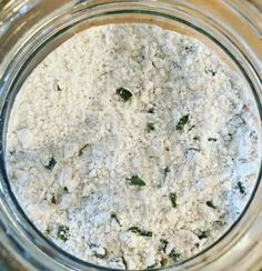 a glass jar filled with food sitting on top of a table