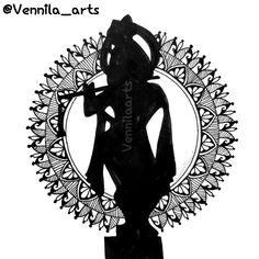 the silhouette of a woman in front of a circle with an ornamental design on it