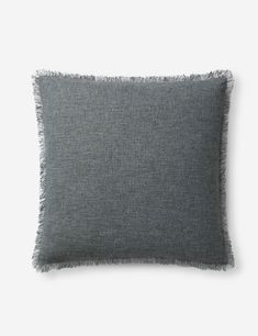 a gray pillow with fray edges on a white background