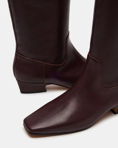 Introducing the GWYNETH square toe boot. These boots offer superior durability and style. Elevate your wardrobe with this versatile footwear option. Perfect for any occasion, the square-toe design provides both comfort and sophistication. 1.5 inch heel height Size 6 measurements: 14.5 inch shaft circumference, 15 inch shaft height Size 8 measurements: 15.5 inch shaft circumference, 15.5 inch shaft height Size 10 measurements: 16.5 inch shaft circumference, 16 inch shaft height Leather upper mate Summer Wardrobe Staples, Meg Ryan, Digital Fashion, Steve Madden Boots, Leather Wear, 5 Inch Heels, Spring Style, Dream Shoes, Classic Outfits