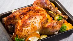 a roasting pan filled with chicken and vegetables