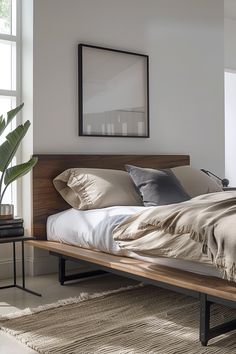 a large bed sitting next to a window in a bedroom