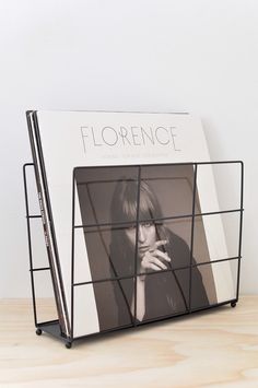 a black and white photo frame with a woman's face in the window on it