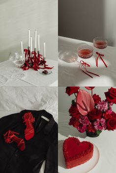 red flowers and candles are arranged on a white tablecloth with black jacket, heart - shaped candle holders, and glass vases