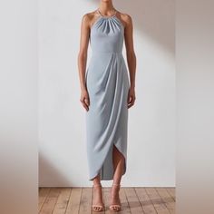 Minimalist And Chic, Perfect For A Bridesmaid Or To Wear To A Formal Event. Signature High Neck Ruched Dress In Soft Matte Fabric. Modest High Neckline. Draped Crossover Skirt With Front Split. Hidden Back Zip. Medium Weight, Non-Stretchy Woven Fabrication. Unlined Measurements Bust: 15 Inches Shoulder To Bottom Hem: 55 Inches Joy Core, Crossover Skirt, Cream Midi Dress, Mother Of Bride Outfits, Matte Fabric, Buy Dresses Online, Shona Joy, Mob Dresses