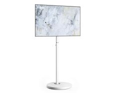 a white and gray marble display on a metal stand with a round base for the tv