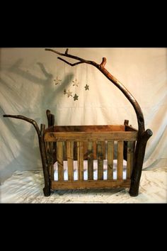 an old crib made out of wood and branches