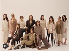 a group of women standing and sitting next to each other