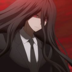 a woman with long black hair wearing a suit and tie in front of a red background