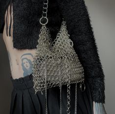 Handmade chainmail bag is made from silver tone steel. Chain is silver-black. High about 20cm. Width about 27cm. Allow up to 7 days for production plus shipping time. Chain Mail Accessories, Chain Mail Outfit, Chain Maille Clothing, Chainmail Aesthetic, Chainmail Sleeves, Crochet Chainmail, Chains Outfit, Chainmail Accessories, Silver Bag Outfit