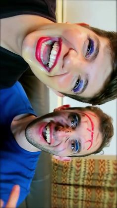 two young men with painted faces posing for the camera