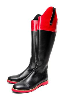 Milenika's handmade black women's tall riding boots, equestrian-inspired boots. These boots feature soft leather, high Spanish-cut topline, almond toe, detailed with back the pull up stripe, red panel and red ultra light and soft sole and zip fastening along back for easy to put on/off.  We like them styled with skinny jeans, sleek leggings or an oversized sweater dress.  Full leather outer, interior and sole.DETAILS:Full leather upper, lining and sole Black and red leatherBlack the pull up stri Black Knee-high Moto Boots For Riding, Black Knee-high Moto Riding Boots, Black Knee-high Boots With Round Toe For Riding, Black Wide Calf Knee-high Boots For Riding, Leather Knee-high Boots For Riding, Riding Knee-high Boots With Leather Sole, Black Flat Boots, Handmade Boots, Shoe Stretcher