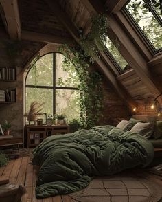 an attic bedroom with green comforter and pillows on the bed in front of a large window