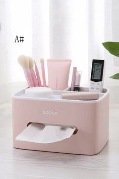 a pink bathroom caddy filled with makeup and toiletries