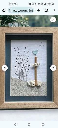 an image of a bird on the beach with sand and seaweed in it's frame