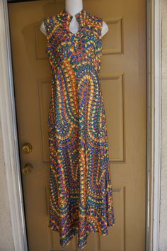 "Vintage 1970s maxi dress. No tags fits like a Large. In good vintage condition. no stains, holes, or tears. Please see measurements. Measurements taken across front lying flat 19\" across front armpit to armpit 14\" across front of empire waist 17\" across natural waist 55\" length" Retro Floor-length Maxi Dress For Summer, Retro Summer Floor-length Maxi Dress, 70s Inspired Fitted Maxi Dress, 1970s Fitted Floor-length Maxi Dress, 1970s Style Fitted Floor-length Maxi Dress, Vintage Multicolor Sleeveless Maxi Dress, Multicolor Sleeveless Vintage Maxi Dress, 1970s Style Multicolor Maxi Dress, Vintage Long Maxi Dress For Festival