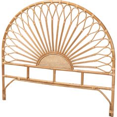 a bed frame made out of bamboo with a sun design on the headboard and foot board