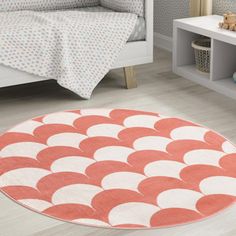 an orange and white area rug in a child's bedroom