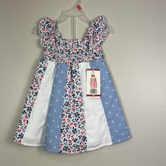 New With Tags Penelope Mack Red White Blue Floral Dress. Comprised Of Different Fabrics. Sleeveless. Smocked At Chest And Lined. Size 18 Months Patriotic And Perfect For The Fourth Of July! 100% Cotton Lining 80% Cotton 20% Poly Smoke Free Home Thank You So Much For Visiting My Closet! Bundle And Save! I Love Offers! Please Keep In Mind That Poshmark Takes A Flat Fee Of $2.95 On All Orders Under $15. For Orders Over $15, Poshmark Takes A 20% Commission. Shop With Confidence. I Have A 5 Seller Ra Casual White Sundress For Dress-up, Red Floral Print Dress For Playtime, Blue Ruffled Dress For Holiday, Holiday Blue Ruffled Dress, Blue Holiday Dress With Ruffles, Blue Holiday Dresses With Ruffles, Cute Blue Holiday Dress, Playful Sleeveless Holiday Dress, Blue Sundress For Summer Playtime